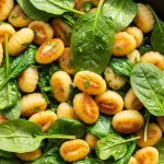 Golden Pan-Fried Gnocchi with Vibrant Spinach Delight